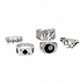 Set of five silver rings with various designs on a white background