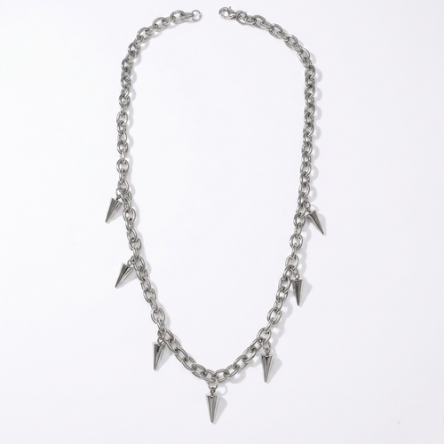 Silver chain necklace with spike-like pendants on a white background