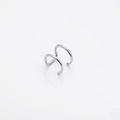 Silver infinity ring on a light gray background